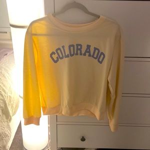 This is a yellow top, wore one time, in great condition. Size Medium